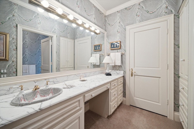 bathroom featuring wallpapered walls, ornamental molding, and vanity