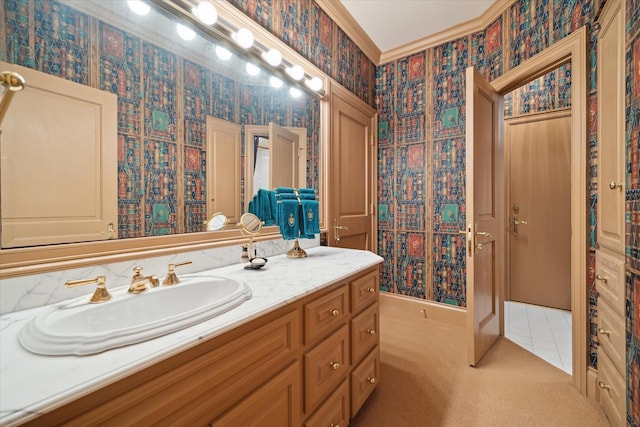 bathroom featuring ornamental molding, tile patterned floors, vanity, and wallpapered walls