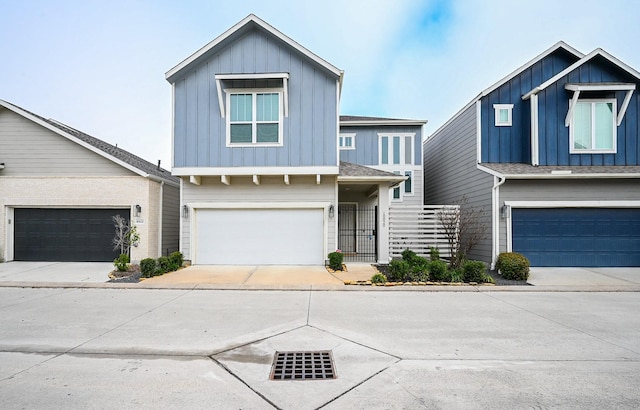 view of front facade featuring a garage, driveway, and board and batten siding