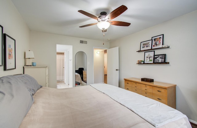 bedroom featuring visible vents, connected bathroom, and ceiling fan