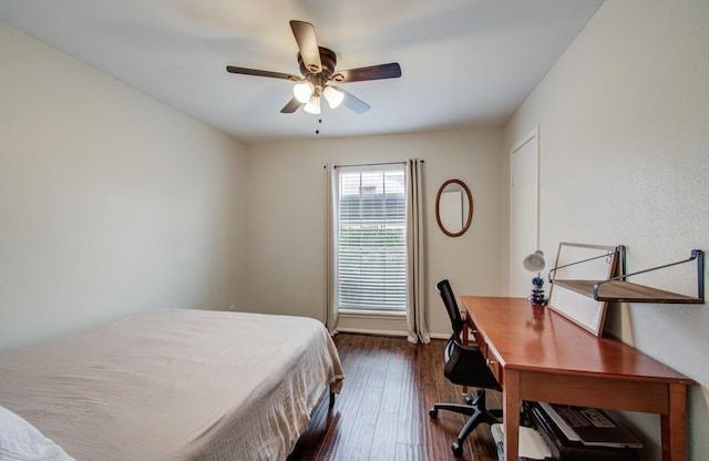 bedroom featuring baseboards, a ceiling fan, and dark wood-style flooring