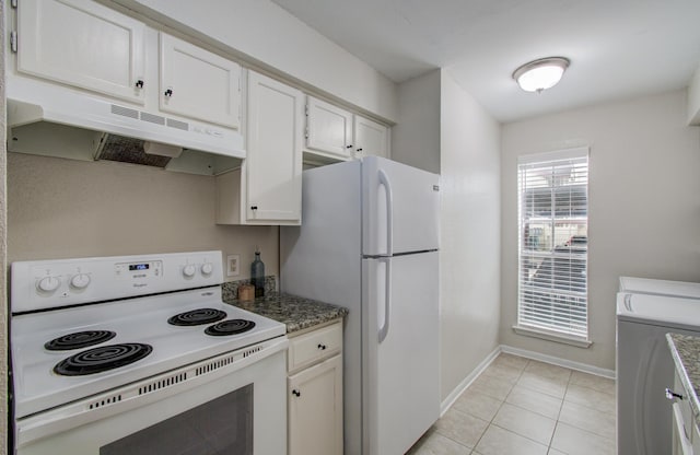 kitchen with white appliances, baseboards, white cabinets, under cabinet range hood, and light tile patterned flooring