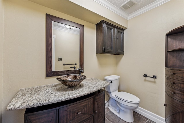 half bathroom with visible vents, vanity, toilet, and crown molding