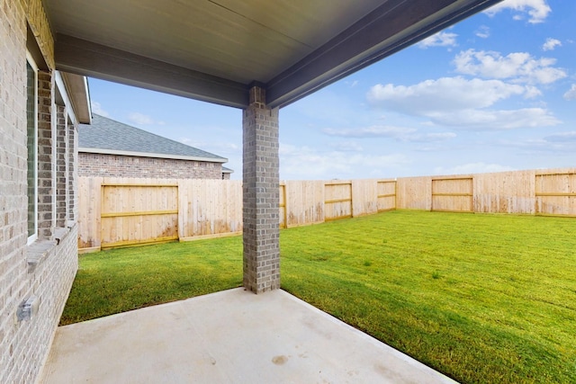 view of yard featuring a patio and a fenced backyard