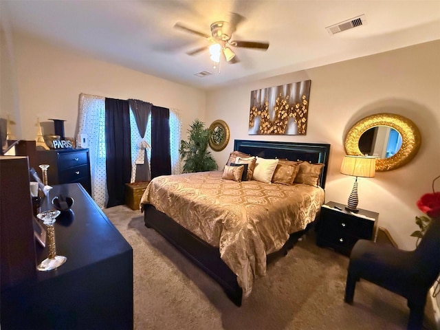 bedroom with ceiling fan, visible vents, and carpet flooring