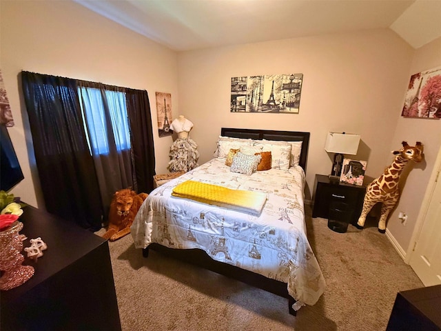 bedroom featuring carpet, lofted ceiling, and baseboards