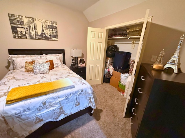 carpeted bedroom featuring vaulted ceiling and a closet