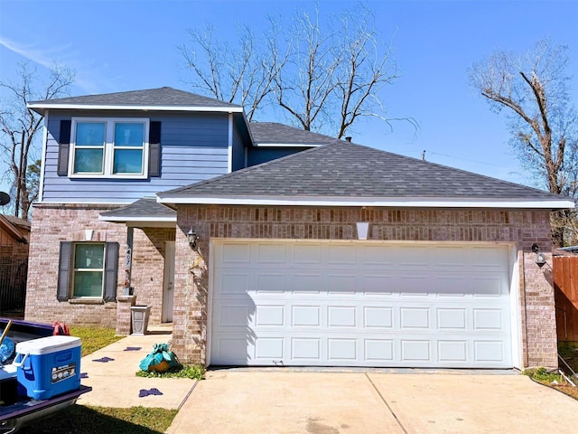 traditional-style home featuring brick siding, driveway, an attached garage, and roof with shingles