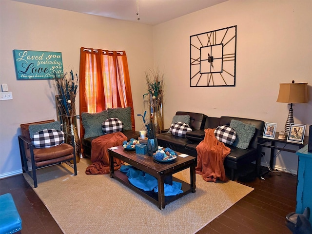 living room featuring wood finished floors and baseboards