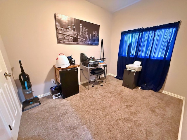 carpeted home office with baseboards