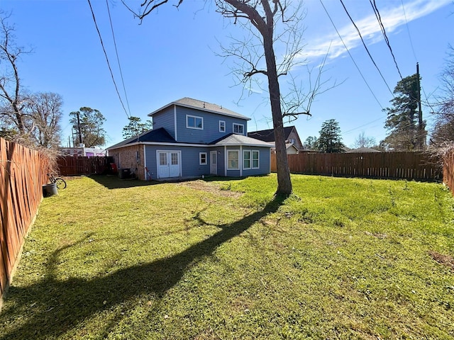 view of yard with a fenced backyard