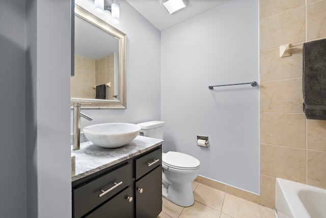 full bathroom with a bathtub, a shower, toilet, vanity, and tile patterned flooring