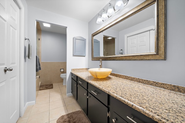 full bathroom with tile patterned flooring, vanity, and toilet