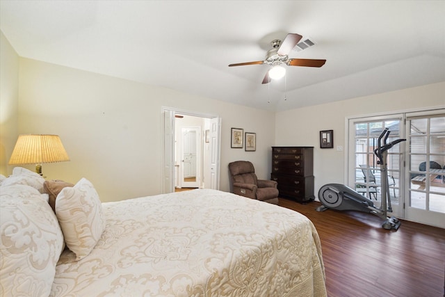 bedroom with visible vents, dark wood finished floors, a raised ceiling, ceiling fan, and access to exterior