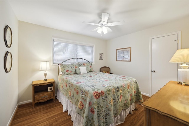 bedroom with wood finished floors, a ceiling fan, and baseboards