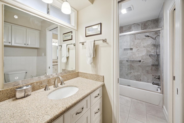 full bath with shower / bath combination, vanity, toilet, and tile patterned floors