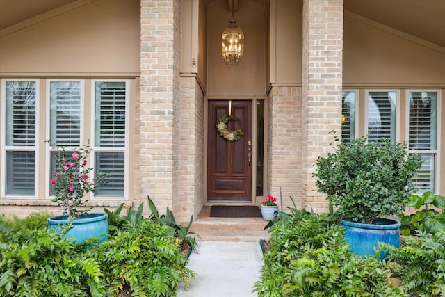 property entrance with brick siding