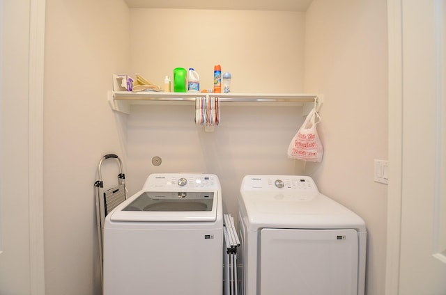 laundry area featuring laundry area and washing machine and dryer