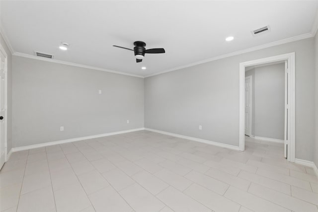 spare room featuring a ceiling fan, visible vents, crown molding, and baseboards