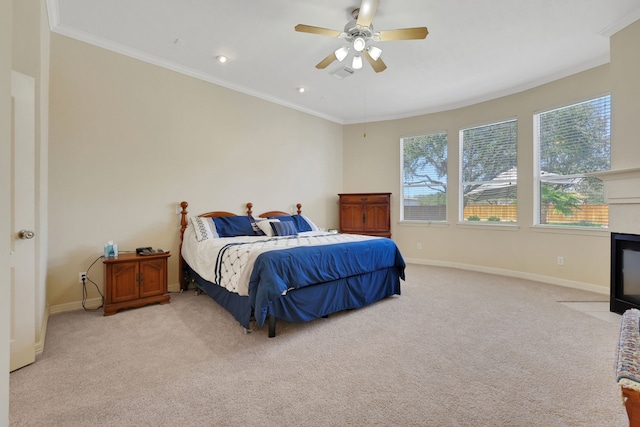 bedroom featuring light carpet, crown molding, and baseboards