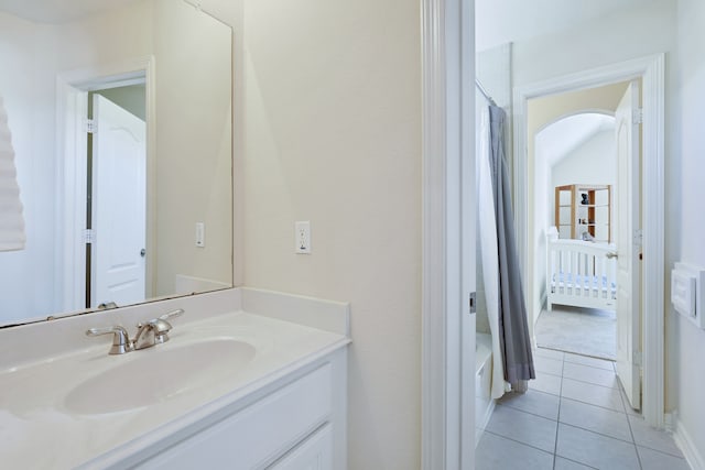 bathroom featuring tile patterned flooring and vanity