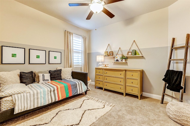 carpeted bedroom with a ceiling fan and baseboards