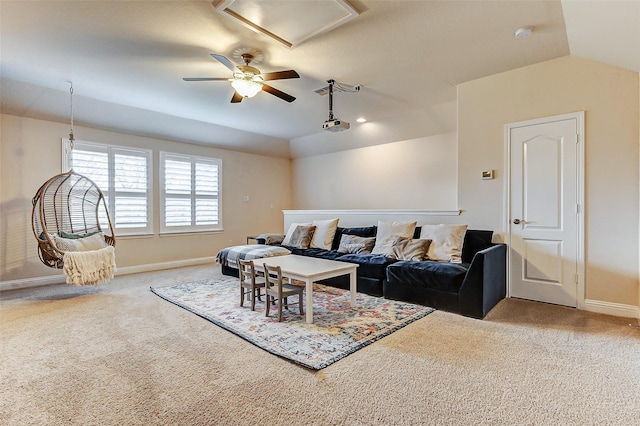 living room with carpet floors, vaulted ceiling, baseboards, and a ceiling fan