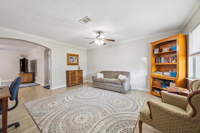 living room with arched walkways, light tile patterned floors, visible vents, baseboards, and crown molding