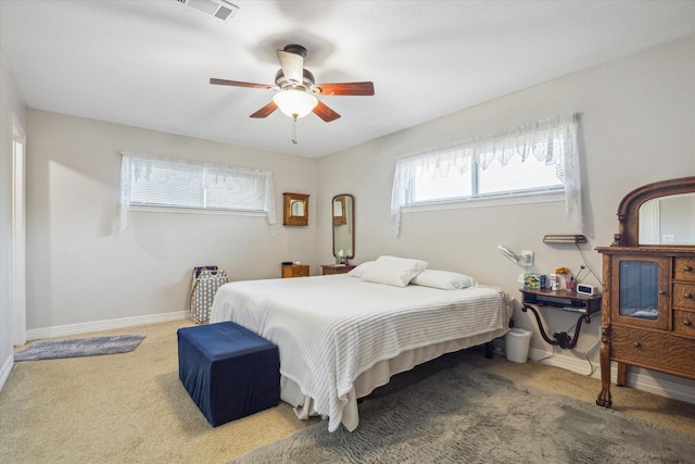 bedroom with carpet, visible vents, ceiling fan, and baseboards