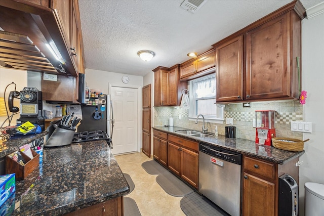 kitchen with visible vents, backsplash, a sink, ventilation hood, and dishwasher