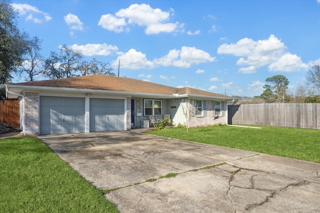 single story home with driveway, an attached garage, fence, and a front yard