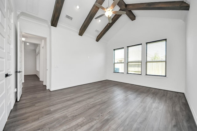 unfurnished room featuring wood finished floors, visible vents, baseboards, a ceiling fan, and beam ceiling