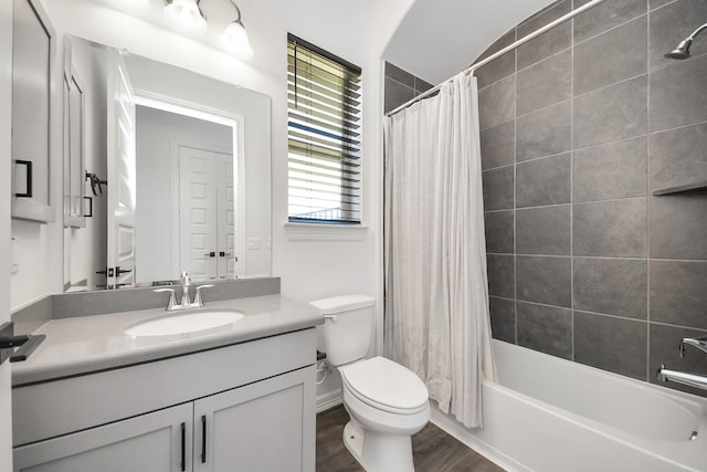 bathroom with toilet, shower / bath combo, wood finished floors, and vanity