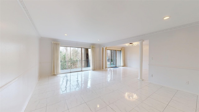 empty room with decorative columns, crown molding, and recessed lighting