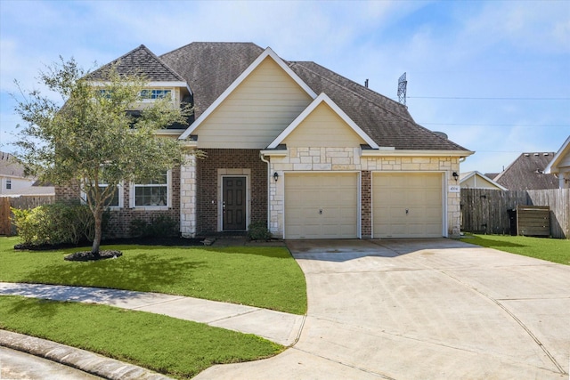 view of front facade with a garage, a front lawn, fence, and brick siding