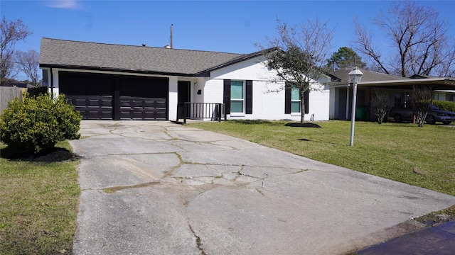 ranch-style house with a garage, brick siding, a shingled roof, concrete driveway, and a front yard