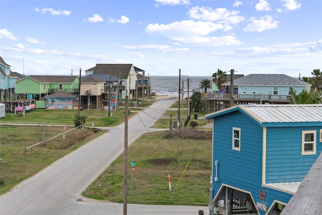 exterior space featuring a residential view and a water view