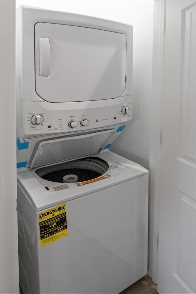 laundry area featuring laundry area and stacked washer / dryer