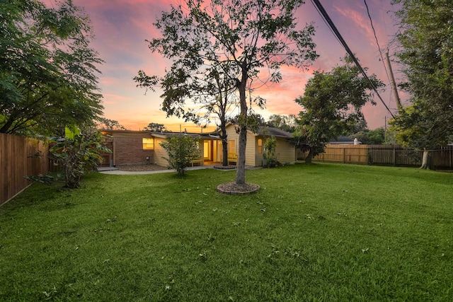 view of yard with a fenced backyard