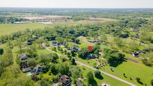 birds eye view of property featuring a rural view