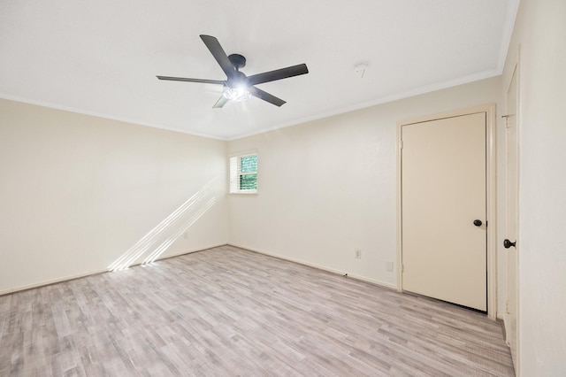 unfurnished room with light wood finished floors, baseboards, ornamental molding, and a ceiling fan