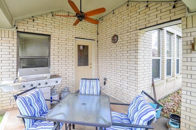 view of patio / terrace with outdoor dining area and a ceiling fan