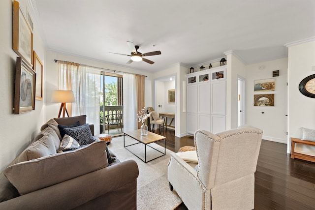 living area with a ceiling fan, crown molding, baseboards, and dark wood-type flooring