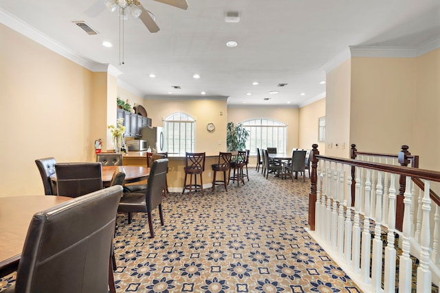 dining area with recessed lighting, light carpet, visible vents, baseboards, and ornamental molding