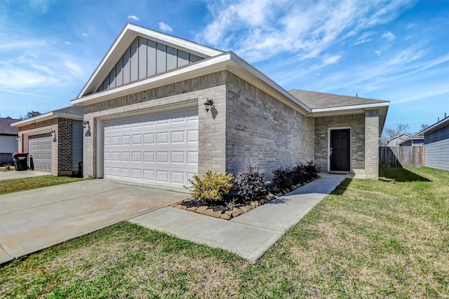 ranch-style house with driveway, fence, a front lawn, board and batten siding, and brick siding