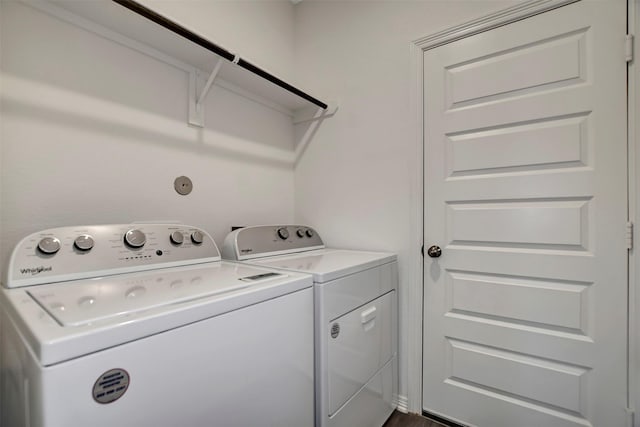 clothes washing area with laundry area and washer and clothes dryer