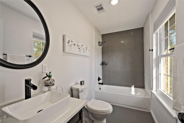 full bath with a healthy amount of sunlight, visible vents, toilet, and tile patterned floors