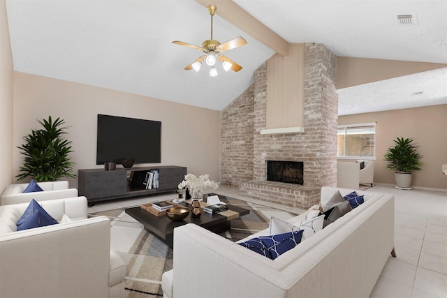 tiled living room featuring beam ceiling, a fireplace, visible vents, a ceiling fan, and a textured ceiling