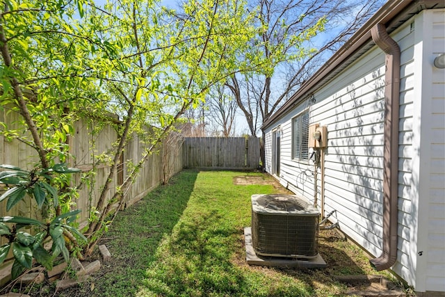 view of yard featuring a fenced backyard and cooling unit