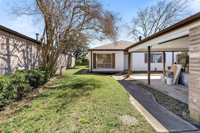 view of yard with a patio area and a fenced backyard